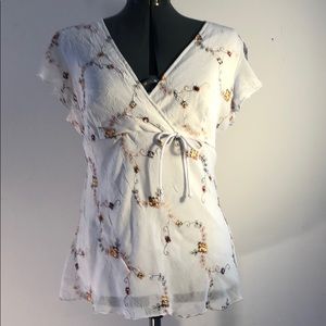 White v-neck, flutter sleeve blouse